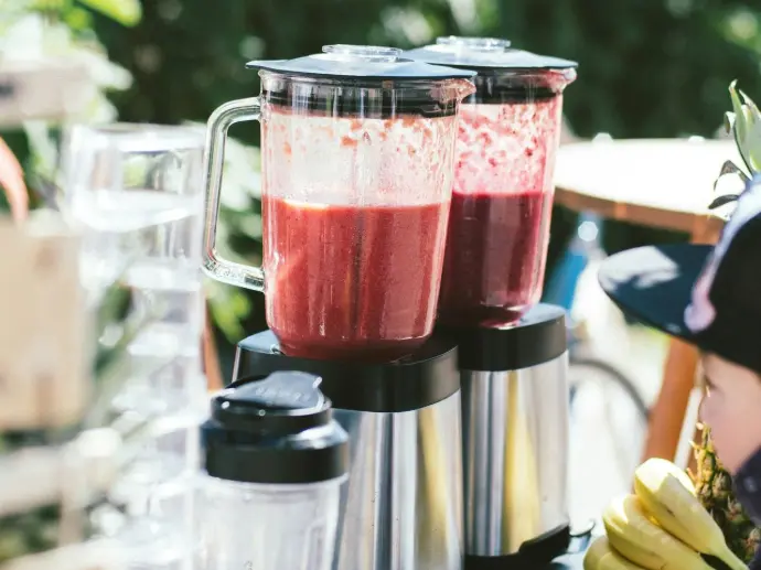 two silver electric blenders